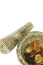 Spices and stone pestle and mortar isolated