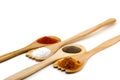 Spices on three wooden spoons isolated on white background Royalty Free Stock Photo