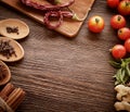 Spices and vegetables in anticipation of cooking on a wooden tab Royalty Free Stock Photo