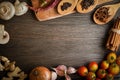 Spices and vegetables in anticipation of cooking on a wooden table Royalty Free Stock Photo