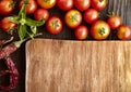 Spices and vegetables in anticipation of cooking on a wooden table Royalty Free Stock Photo