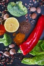 Spices, vegetables and herbs on a stone background. View from above Royalty Free Stock Photo