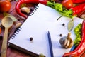 Spices, vegetables, and a notebook Royalty Free Stock Photo