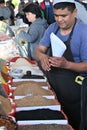 Spices vendor serving a customer in Chorsu bazaar in Tashkent, Uzbekistan