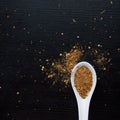 Spices were scattered on black wooden table. Measuring spoon. Cooking and seasoning for taste Royalty Free Stock Photo