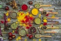 Spices in a wooden bowl, fresh tomatoes and hot red pepper lie on an old table Royalty Free Stock Photo