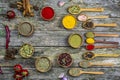 Spices in a wooden bowl, a mixture of peppers on an old wooden table with space for text Royalty Free Stock Photo