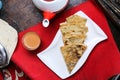 Spicy Arayes with coffe cup and teapot served in dish isolated on red mat top view on table arabic food