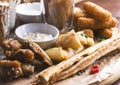 Spicy baked chicken wings, bread sticks with appetizers and sauce Royalty Free Stock Photo