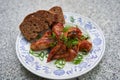 Spicy barbecue chicken buffalo wings marinated and served with whole grain bread.