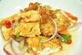 Spicy batter slice fried egg with chop pork and shallot Thai salad on plate