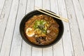 spicy beef ramen with miso, boiled bamboo, boiled egg, chives, nori seaweed Royalty Free Stock Photo