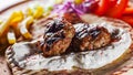 Spicy bifteki, frikadelle or frikkadel meatballs with minced beef and lamb with pita bread, tzatziki dip, vegetables salad and Fre Royalty Free Stock Photo