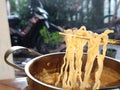 Spicy boiled noodles in the raining season