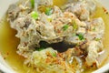 Spicy boiled pork bone dressing cayenne pepper soup on bowl Royalty Free Stock Photo