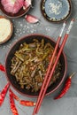 Spicy bracken  fern salad with onion, garlic, chili pepper, soy sauce, sesame seeds and spices Royalty Free Stock Photo