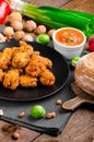 Spicy breaded chicken wings with homemade bread Royalty Free Stock Photo