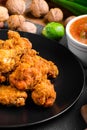 Spicy breaded chicken wings with homemade bread Royalty Free Stock Photo