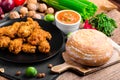 Spicy breaded chicken wings with homemade bread Royalty Free Stock Photo