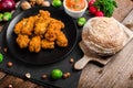 Spicy breaded chicken wings with homemade bread Royalty Free Stock Photo