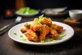 spicy buffalo wings on a plate with celery sticks Royalty Free Stock Photo