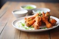 spicy buffalo wings with a side of ranch dressing Royalty Free Stock Photo