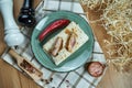 Spicy burrito or shawarma on a blue plate with traditional pork in a composition with spices. Close up view. Food photo. Flat lay