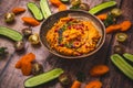 Spicy carrot hummus with raw vegetable sticks Royalty Free Stock Photo