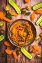Spicy carrot hummus with raw vegetable sticks Royalty Free Stock Photo