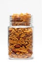 Spicy Chatpata Mixture in a glass jar, made with peanuts, corn flakes.