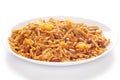 Spicy Chatpata Mixture in a white ceramic plate made with peanuts, corn flakes,