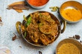 Spicy Chicken Karahi with masala powder served in a dish isolated on grey background top view of bangladesh food Royalty Free Stock Photo
