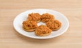 Spicy chicken salad on butter crackers atop a wood table Royalty Free Stock Photo