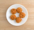 Spicy chicken salad on butter crackers on plate