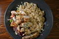 Spicy chicken on stir rice with salad and vegetables top view