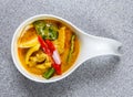 Spicy chicken yellow curry served in dish isolated on grey background top view of hong kong food Royalty Free Stock Photo