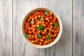 Spicy Chickpea curry Chana Masala in bowl on wooden table