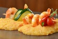 Spicy chili prawn skewers and polenta Royalty Free Stock Photo