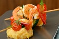 Spicy chili prawn skewers and polenta Royalty Free Stock Photo