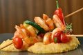 Spicy chili prawn skewers and polenta Royalty Free Stock Photo