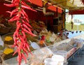 Spicy chillies hanging from a stand Royalty Free Stock Photo