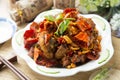 Spicy chinese braised pork on white plate