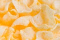 Spicy chips flakes closeup with blur background, texture.