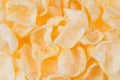 Spicy chips flakes top view as texture, background. Royalty Free Stock Photo