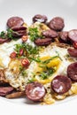 Spicy chorizo sausage and eggs spanish huevos rotos tapas snack