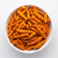 Spicy Chutney Sev in a white Ceramic bowl made with Chickpea flour and red chili. Pile of Indian spicy snacks Namkeen,