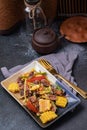 Spicy Cockles Salad with Corn in a Black Table Top Plate