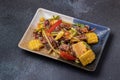 Spicy Cockles Salad with Corn in a Black Table Top Plate