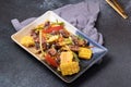 Spicy Cockles Salad with Corn in a Black Table Top Plate