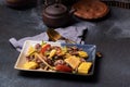 Spicy Cockles Salad with Corn in a Black Table Top Plate